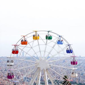 Low angle view of ferris wheel against sky