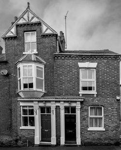 Facade of house against sky