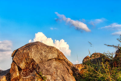 Low angle view of rocks against sky