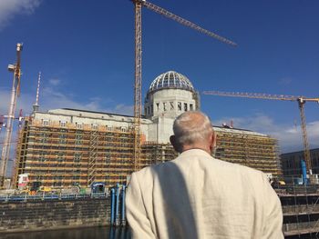 Low angle view of tower against cloudy sky