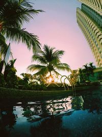 Scenic view of lake against sky at sunset