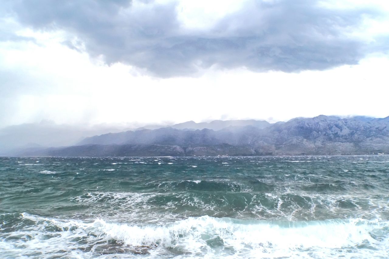 SCENIC VIEW OF SEA AND MOUNTAIN AGAINST SKY