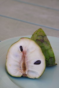 High angle view of fruits in plate on table