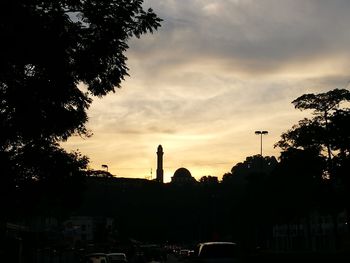 Silhouette trees against sky during sunset