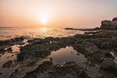 Scenic view of sea against sky during sunset