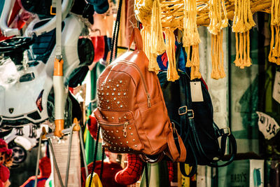 Rear view of clothes hanging in store for sale