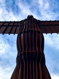 Low angle view of sculpture against sky