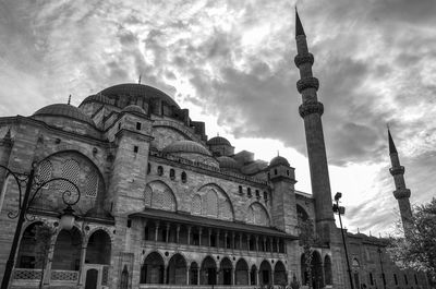 Low angle view of cathedral against cloudy sky