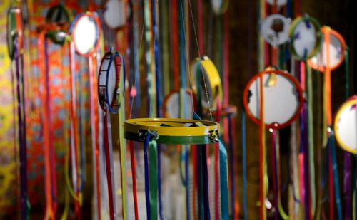 Tambourines hanging with multi colored ribbons