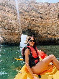 Portrait of woman in boat in sea
