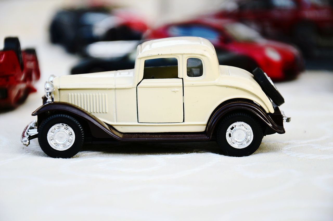 CLOSE-UP OF VINTAGE TOY CAR
