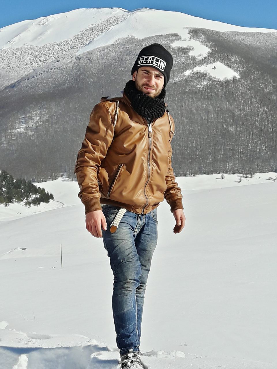 FULL LENGTH PORTRAIT OF A MAN STANDING ON SNOW