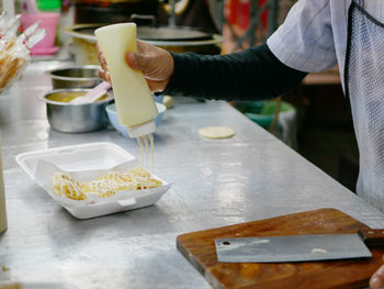 Cropped image of man preparing food