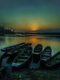 Scenic view of lake against sky at sunset