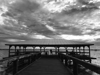 Pier over sea against sky