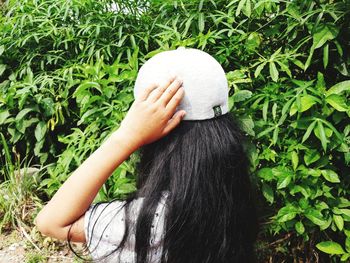 Portrait of woman wearing hat outdoors