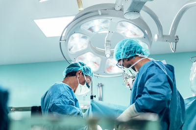 Midsection of scientist working in laboratory