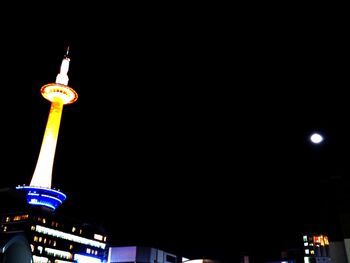 Low angle view of illuminated building at night