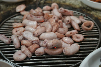 High angle view of meat on barbecue grill