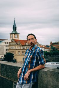 Portrait of  a man standing in a bridge