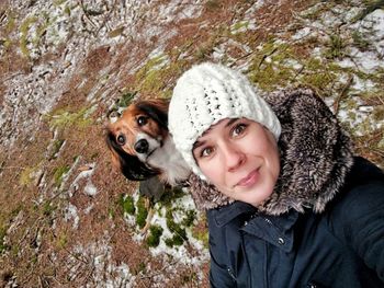 Portrait of smiling woman with dog