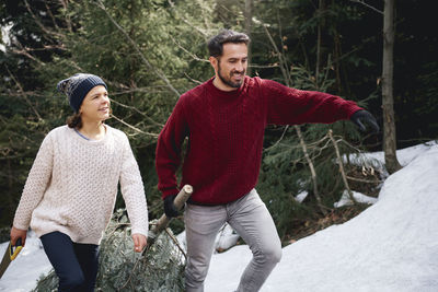 Full length of a smiling young woman in winter