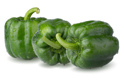 Close-up of green bell pepper against white background