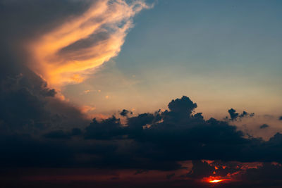 Low angle view of dramatic sky during sunset