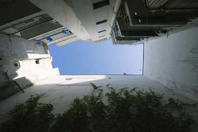 Low angle view of buildings against blue sky