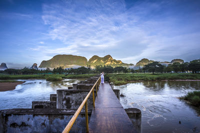 Bridge over river against sky