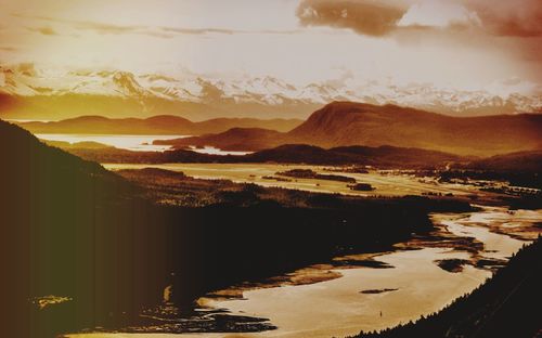 Scenic view of mountains against sky during sunset