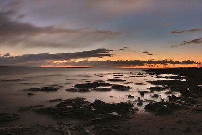 Scenic view of sea at sunset