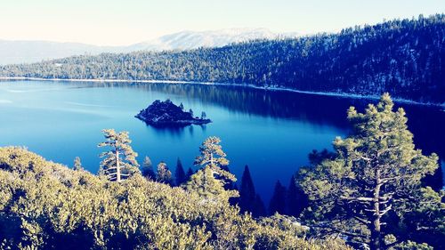 Scenic view of lake against sky during winter