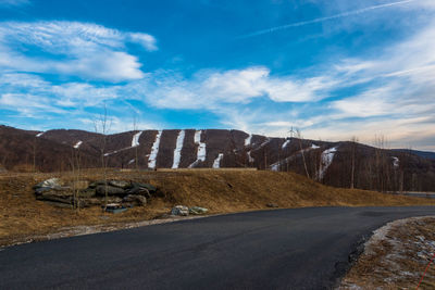 Scenic view of farm against sky