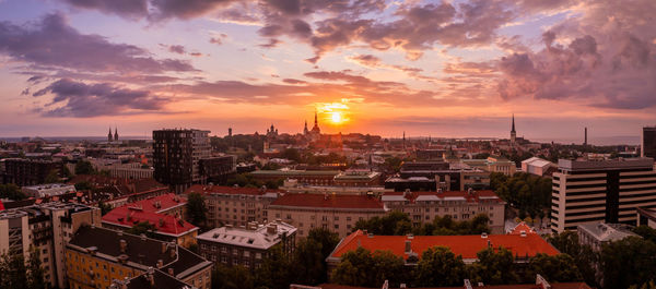 Panoramic view of old tallinn city at purple sunset, estonia.