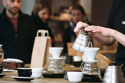 Cropped image of hand holding drink