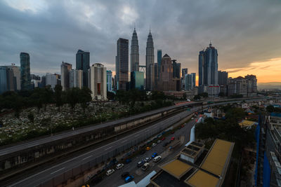 High angle view of street amidst buildings against sky