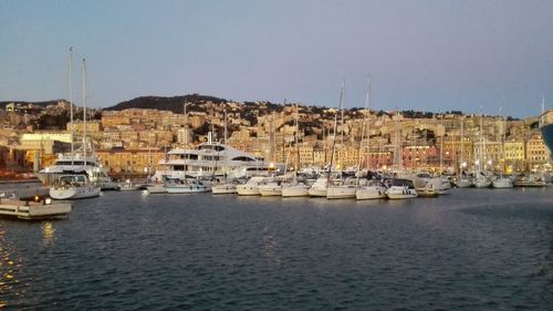 Boats moored at harbor