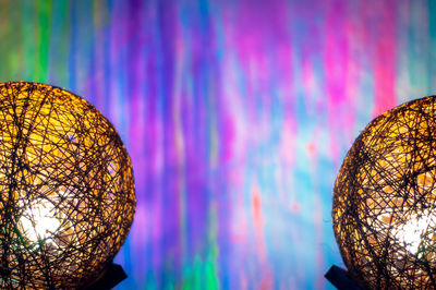 Low angle view of illuminated lights against trees