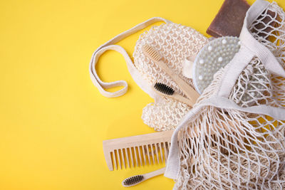 High angle view of shoes on table against yellow background