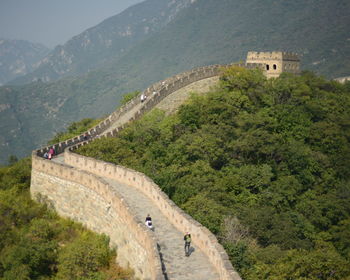 High angle view of great wall of china against mountain