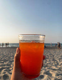 Close-up of hand holding drink