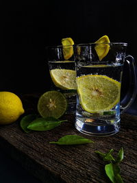 Close-up of drink on table against black background