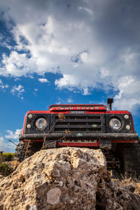 Low angle view of machinery against sky