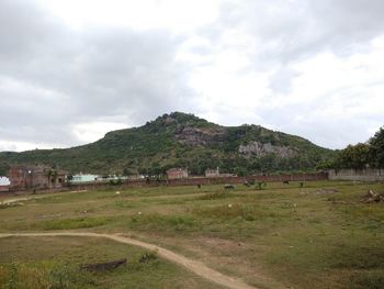 Scenic view of landscape and mountains against sky