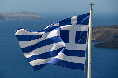 Low angle view of hellenic flag against sky