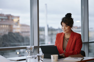 Businesswoman using tablet in office