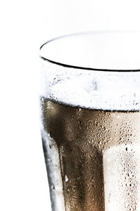 Close-up of drink over white background