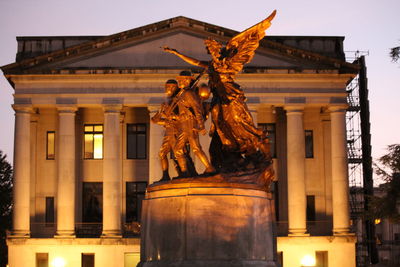 Low angle view of statue outside building