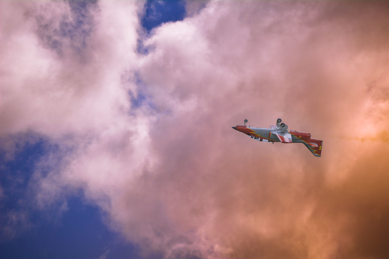 LOW ANGLE VIEW OF AIRPLANE FLYING IN SKY